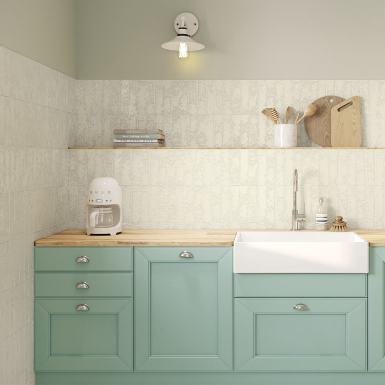 white brick look tile on kitchen wall and backsplash with green mint cabinets