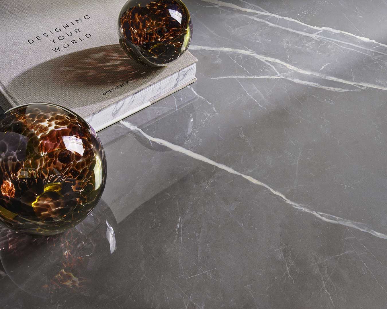 Versaille Grey marble-look porcelain surface styled with glass decor