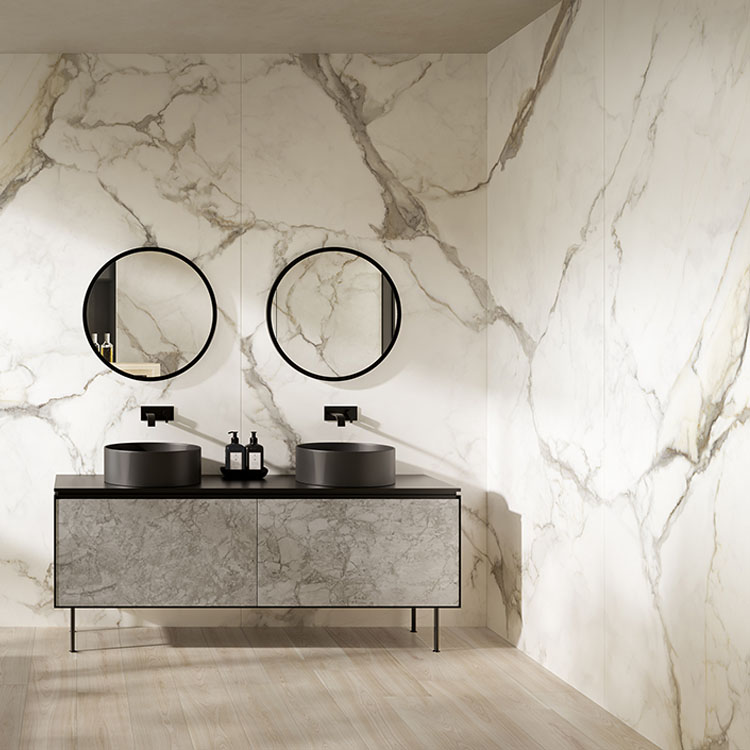 marble porcelain tile on bathroom walls with grey cabinets 