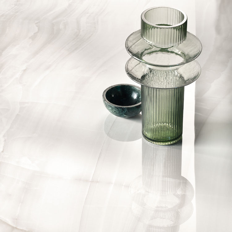 close up with green accents of marble tile with subtle veining